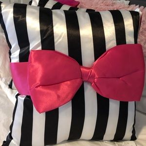 Black and white striped pillows with pink bows
